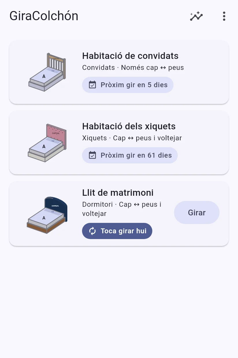 Pantalla d'inici de GiraColchón amb tres matalassos d'aspecte diferent; al llit de matrimoni li toca girar hui